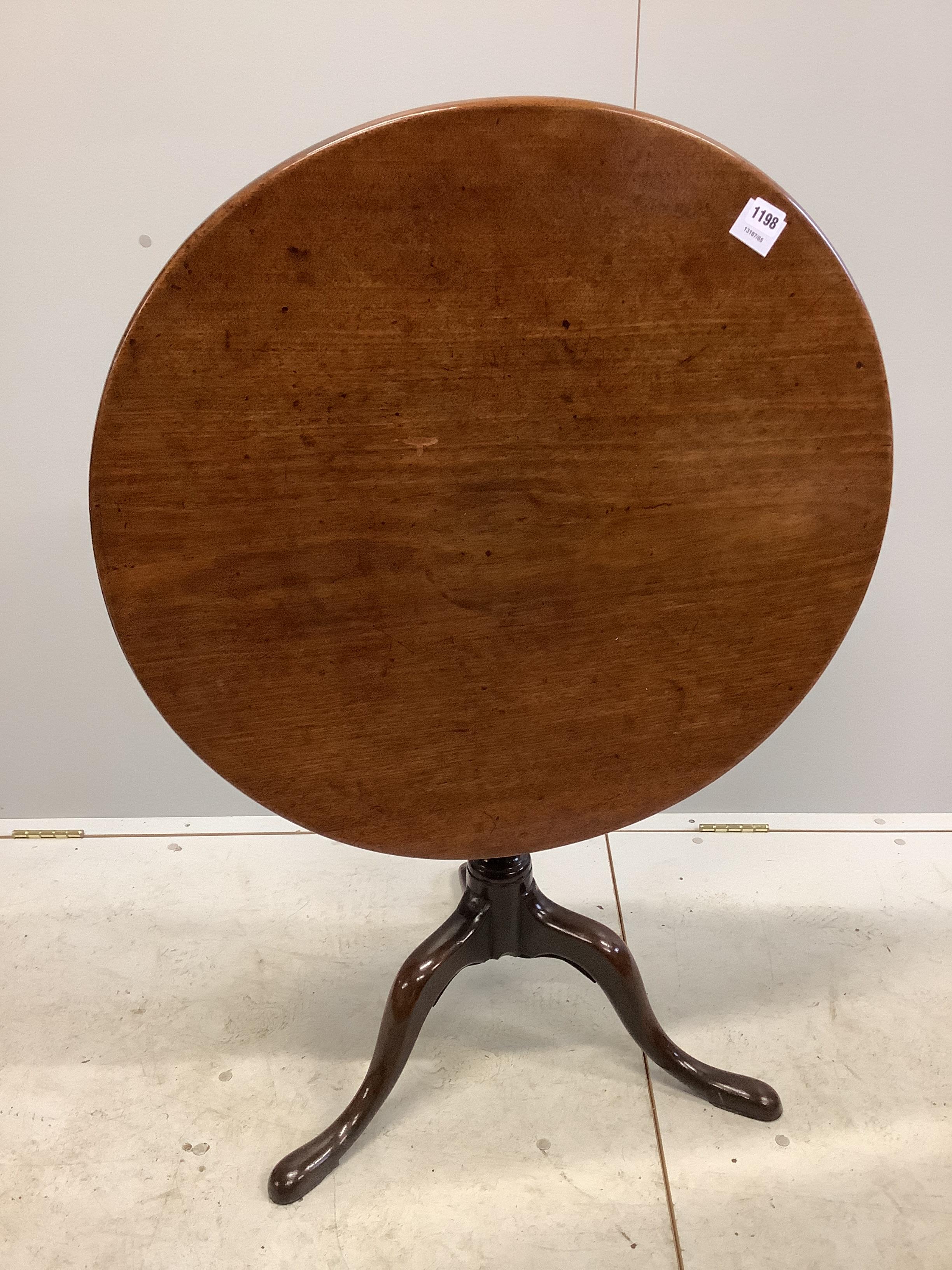 A George III mahogany tilt top tripod tea table, diameter 74cm, height 68cm